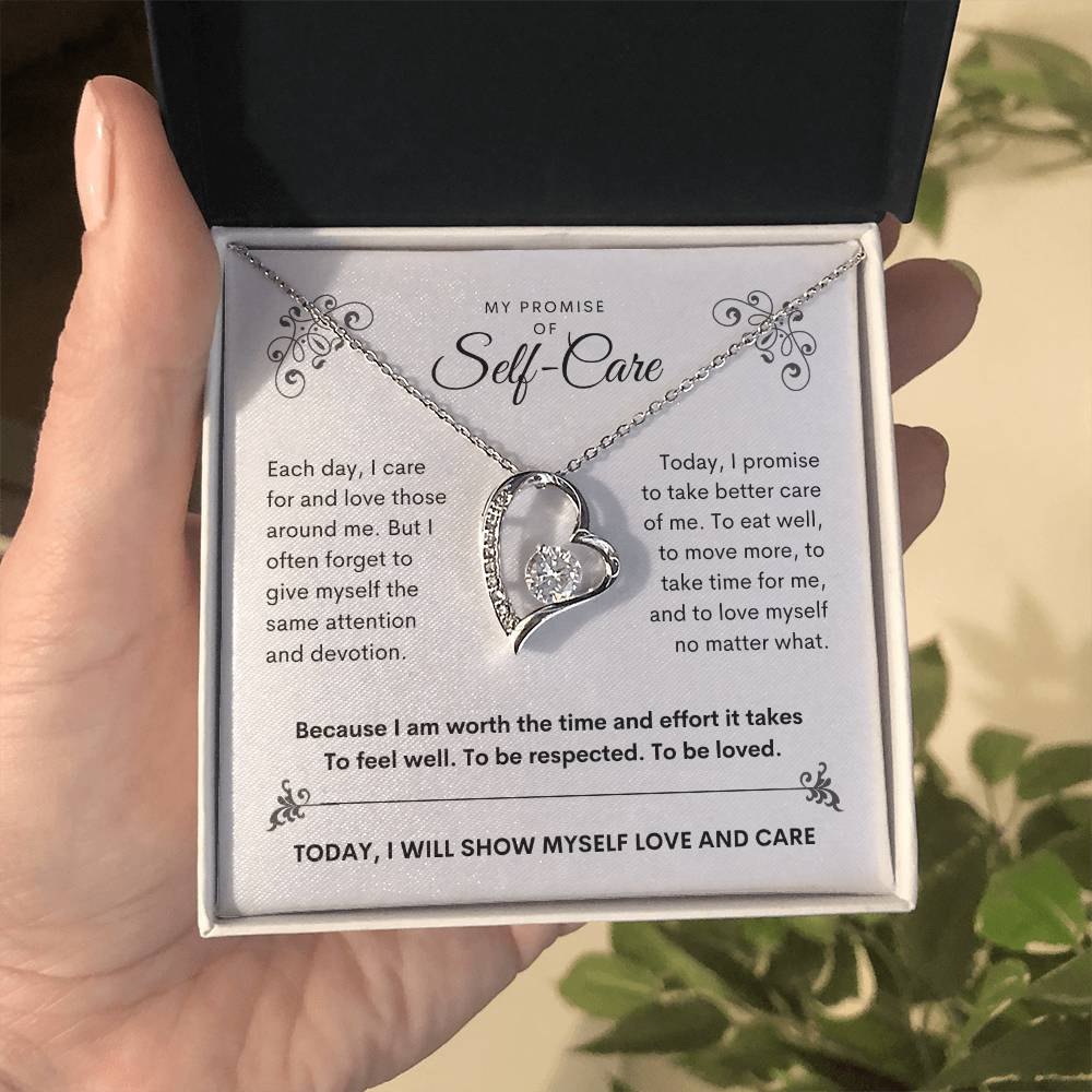 my promise of self care gold necklace in hand