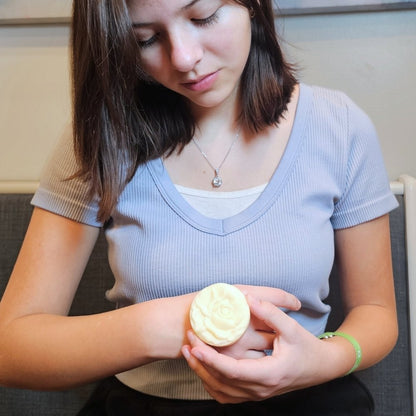 Woman using lotion bar