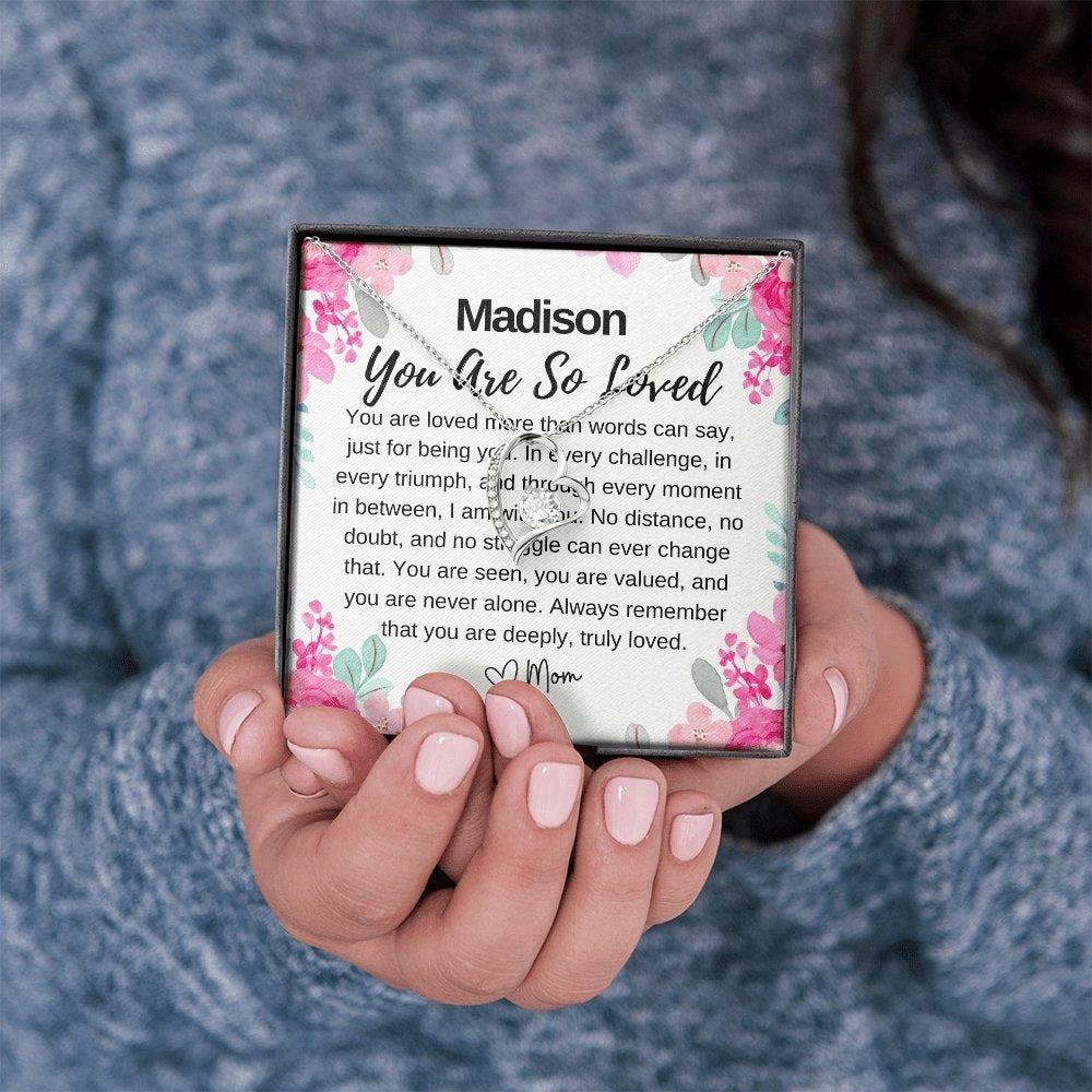 custom you are loved silver necklace in hand