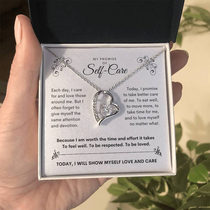 my promise of self care gold necklace in hand